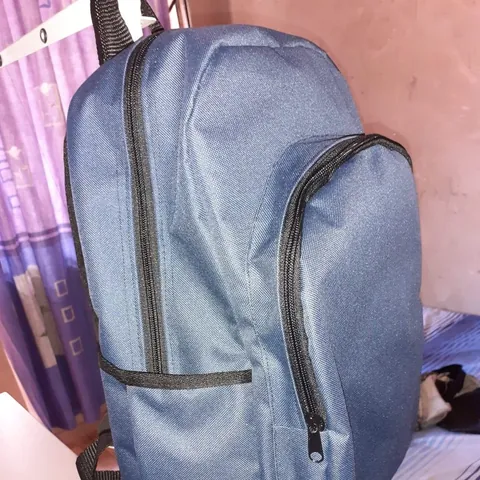 A blue backpack with side pockets