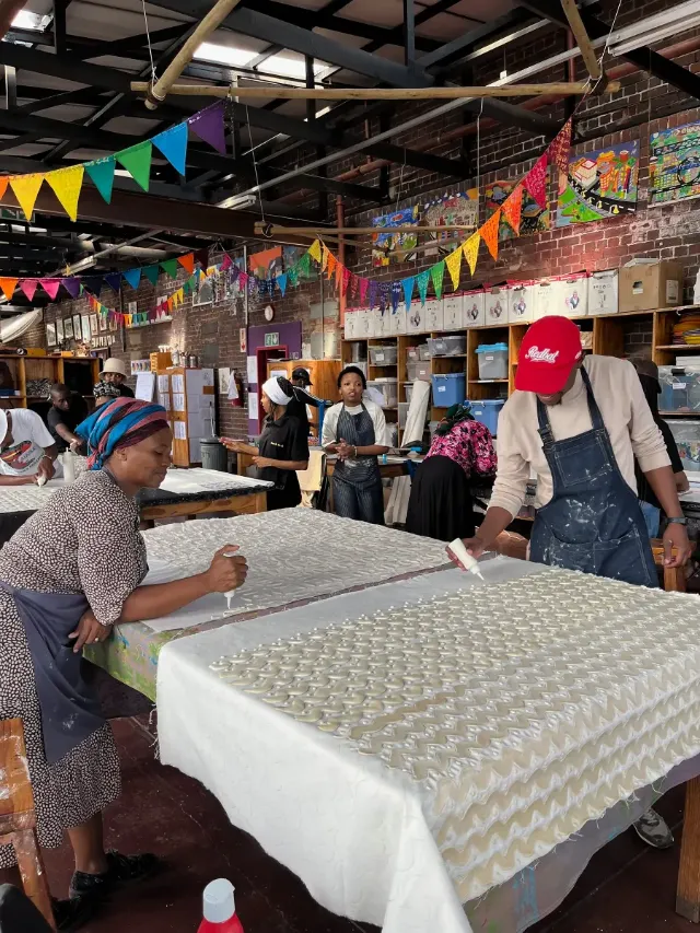 Makers at work in the busy Imbali print room